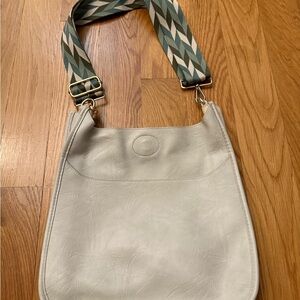 Stylish White Shoulder Bag with Patterned Strap